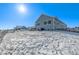 Large backyard with snow-covered ground at 16122 Emporia Way, Brighton, CO 80602