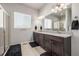 Double vanity bathroom with granite countertop at 16122 Emporia Way, Brighton, CO 80602