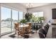 Dining area with sliding glass doors leading to a deck with scenic views at 16122 Emporia Way, Brighton, CO 80602