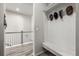 Convenient coat closet with bench in the hallway at 16122 Emporia Way, Brighton, CO 80602