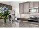 Kitchen island with granite countertop, double sink, and stainless steel appliances at 16122 Emporia Way, Brighton, CO 80602