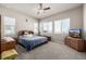 Large main bedroom with carpeted floors, ceiling fan, and ample natural light at 16122 Emporia Way, Brighton, CO 80602