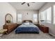 Main bedroom with carpeted floor, ceiling fan, and dresser with mirror at 16122 Emporia Way, Brighton, CO 80602