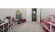 Bright playroom with plenty of space for toys and activities at 16122 Emporia Way, Brighton, CO 80602