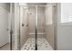 Large walk-in shower with glass enclosure and built-in seat at 16122 Emporia Way, Brighton, CO 80602