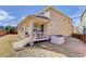 Spacious backyard featuring a covered patio, perfect for outdoor living at 2454 Ambience Ln, Castle Rock, CO 80109