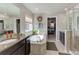 Bright bathroom boasts dual sinks, a soaking tub, and a separate walk-in shower at 2454 Ambience Ln, Castle Rock, CO 80109