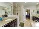 Contemporary bathroom with dual sinks, granite countertops, and glass shower enclosure at 2454 Ambience Ln, Castle Rock, CO 80109