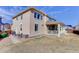 Exterior view of home featuring a covered patio and well-maintained landscaping at 2454 Ambience Ln, Castle Rock, CO 80109