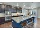 Modern kitchen with granite counters, stainless appliances, and seating at the island at 2454 Ambience Ln, Castle Rock, CO 80109