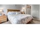 Bright bedroom with neutral color palette, comfortable king size bed and carpeted floor at 4013 S Carson St # C, Aurora, CO 80014