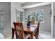 Cozy dining area features a wooden table, four chairs and natural light from two windows at 4013 S Carson St # C, Aurora, CO 80014