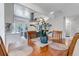 Dining area with overhead lighting, and view into the kitchen and entryway with staircase at 4013 S Carson St # C, Aurora, CO 80014