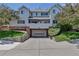Exterior of home showing garage and second story deck at 4013 S Carson St # C, Aurora, CO 80014