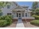 Charming home featuring a covered front entrance with a walkway and manicured landscaping at 4013 S Carson St # C, Aurora, CO 80014
