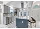 Modern kitchen with granite countertops, stainless steel appliances, and a spacious island with barstool seating at 4013 S Carson St # C, Aurora, CO 80014