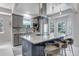 Stylish kitchen featuring an island with bar seating, granite countertops, and stainless-steel appliances at 4013 S Carson St # C, Aurora, CO 80014