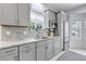 Bright kitchen features gray cabinets, granite countertops and stainless steel appliances at 4013 S Carson St # C, Aurora, CO 80014
