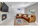 Inviting living room boasts a cozy fireplace, comfortable sofa and an area rug at 4013 S Carson St # C, Aurora, CO 80014