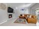 Inviting living room boasts a cozy fireplace, comfortable sofa and an area rug at 4013 S Carson St # C, Aurora, CO 80014