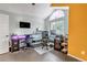 Bright office featuring a large window, ample desk space, and modern minimalist design at 4013 S Carson St # C, Aurora, CO 80014
