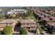 An aerial view displays beautiful townhomes and community landscape in a desirable neighborhood at 3454 Cascina Pl # D, Highlands Ranch, CO 80126