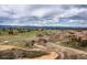 Beautiful aerial view of community, green space, walking trails, stream, and mountain views at 3454 Cascina Pl # D, Highlands Ranch, CO 80126