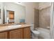 Bathroom featuring a shower and tub combination, vanity with sink, and tiled surround at 3454 Cascina Pl # D, Highlands Ranch, CO 80126