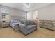 Bedroom featuring an area for seating, dresser, and natural light creating a comfortable retreat at 3454 Cascina Pl # D, Highlands Ranch, CO 80126