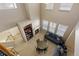 Open-concept living room with abundant natural light, fireplace, and views of the stairwell at 3454 Cascina Pl # D, Highlands Ranch, CO 80126