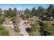 A community playground boasts a slide, benches, and winding path with mature shade trees at 3454 Cascina Pl # D, Highlands Ranch, CO 80126