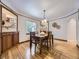 Inviting dining room with hardwood floors, built-in shelving, and a large window creating a warm atmosphere at 2260 Leyden St, Denver, CO 80207