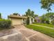 Attractive single-story home featuring a well-maintained lawn and a two-car garage at 2260 Leyden St, Denver, CO 80207