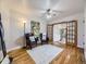 Cozy living room featuring hardwood floors, stylish furnishings, and a ceiling fan for comfort at 2260 Leyden St, Denver, CO 80207