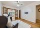Living room with wood floors, French doors, and access to sunroom offers stylish comfort at 2260 Leyden St, Denver, CO 80207