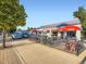Restaurant exterior with outdoor patio featuring tables with umbrellas at 2260 Leyden St, Denver, CO 80207