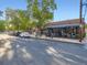 Street view of a charming brick pizzeria with outdoor seating under a shady tree at 2260 Leyden St, Denver, CO 80207