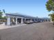 The exterior of a retail strip mall featuring multiple storefronts and ample parking at 2260 Leyden St, Denver, CO 80207