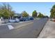 Wide street view of a retail area with visible storefronts and parking spaces at 2260 Leyden St, Denver, CO 80207