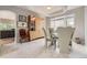 Elegant dining area with modern lighting and a glass-top table, perfect for Gathering meals at 1312 Pine View Rd, Golden, CO 80403