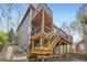 Exterior view of a multi-level deck providing a spacious outdoor living area with stairs at 1312 Pine View Rd, Golden, CO 80403