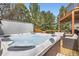 Deck featuring a hot tub with clear water and seating for ultimate relaxation and enjoyment at 1312 Pine View Rd, Golden, CO 80403
