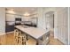 Well-lit kitchen featuring stainless steel appliances, ample counter space, and a breakfast bar at 1312 Pine View Rd, Golden, CO 80403