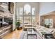 Bright living room features a fireplace, a sectional sofa, and an abundance of natural light at 1312 Pine View Rd, Golden, CO 80403