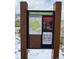Informative Jeffco Open Space sign with a map and regulations, set against a snowy, mountainous backdrop at 1312 Pine View Rd, Golden, CO 80403