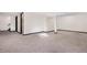 Finished basement area with neutral carpet, ready for customization at 1456 S Jasper St, Aurora, CO 80017