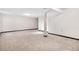 Spacious basement area with carpet and a support beam at 1456 S Jasper St, Aurora, CO 80017