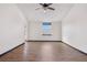 An expansive bedroom features gleaming wood floors and a window that provides plenty of natural light at 1456 S Jasper St, Aurora, CO 80017