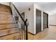 Inviting entryway with hardwood floors, staircase with wrought iron railings, and decorative accents at 1456 S Jasper St, Aurora, CO 80017