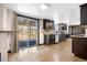 Bright and stylish kitchen with modern appliances and a sliding door leading to the outdoor space at 1456 S Jasper St, Aurora, CO 80017